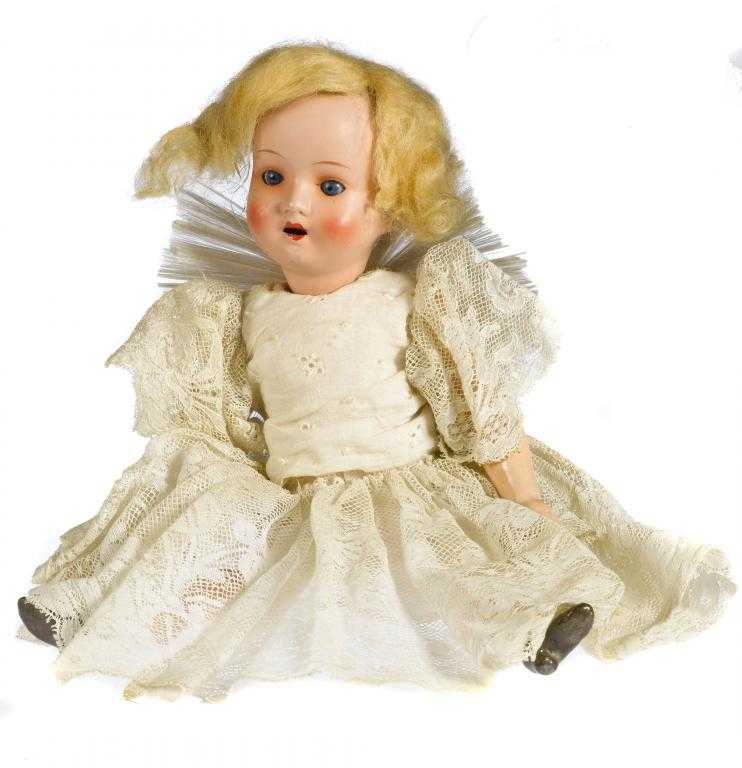 Appraisal: A GERMAN BISQUE SHOULDER HEADED DOLL with moulded wavy blond