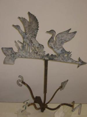 Appraisal: A CAST ALUMINIUM WEATHER VANE modelled with two ducks th