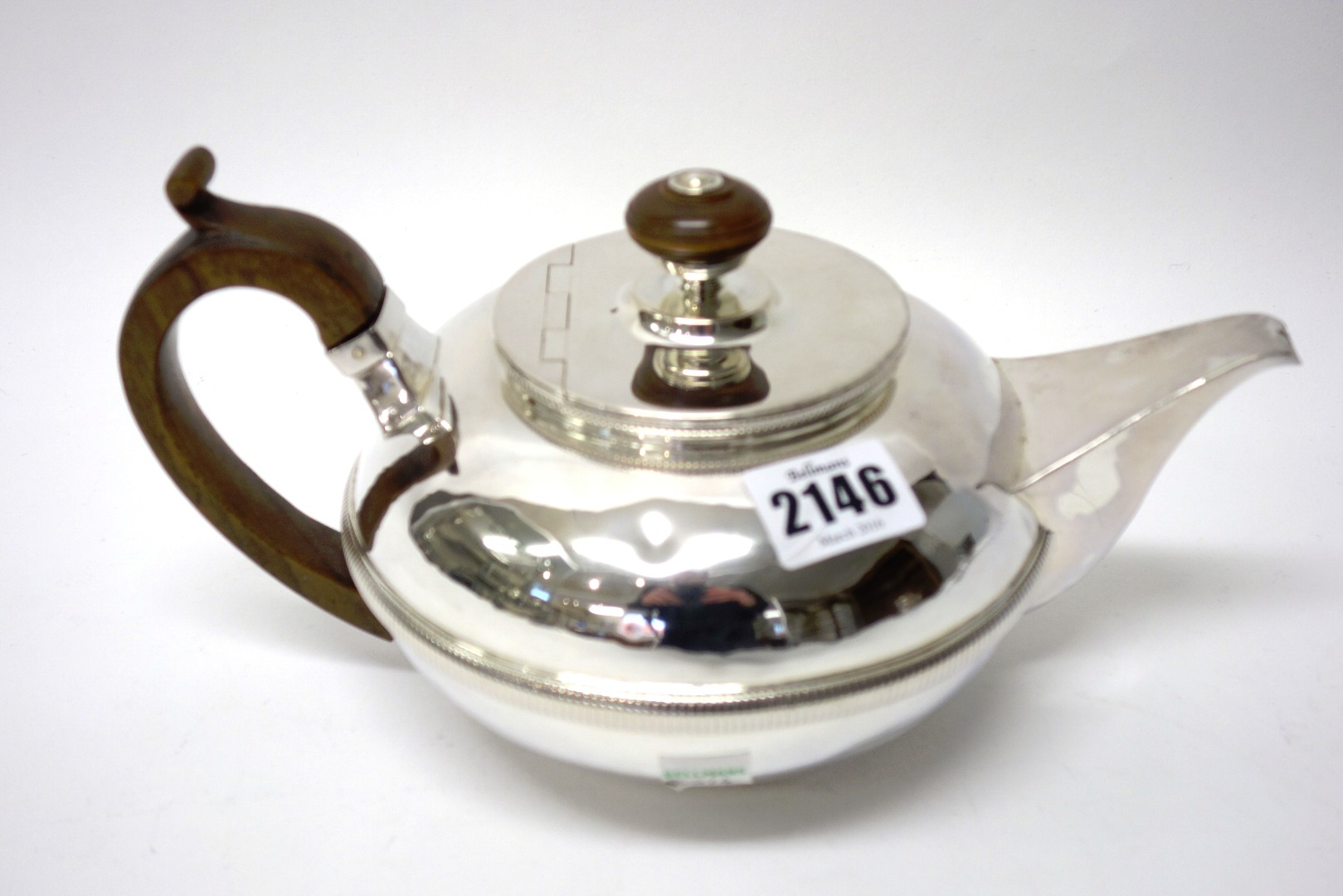 Appraisal: A European silver teapot of squat circular form decorated with