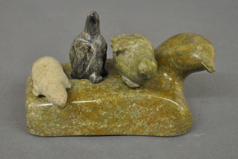 Appraisal: - Carved Inuit stone figure of seals and birds signed