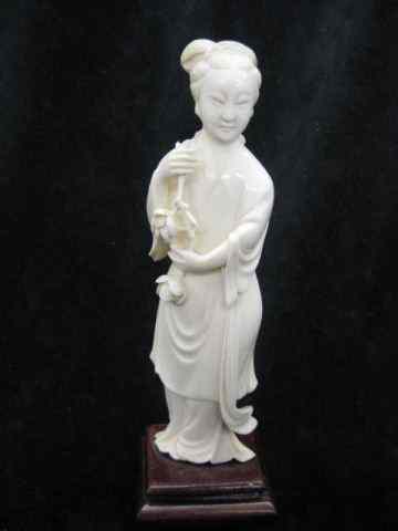 Appraisal: Chinese Carved Ivory Figurine of a Lady holding flowers fine