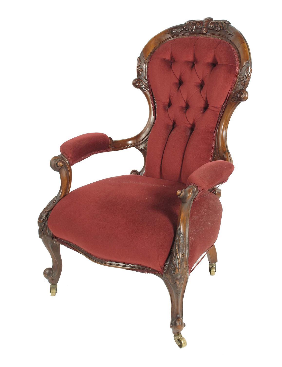 Appraisal: A Victorian walnut open armchair