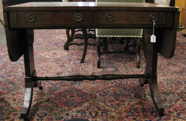 Appraisal: Baker Furniture Co two-drawer foyer table on casters traditional styling