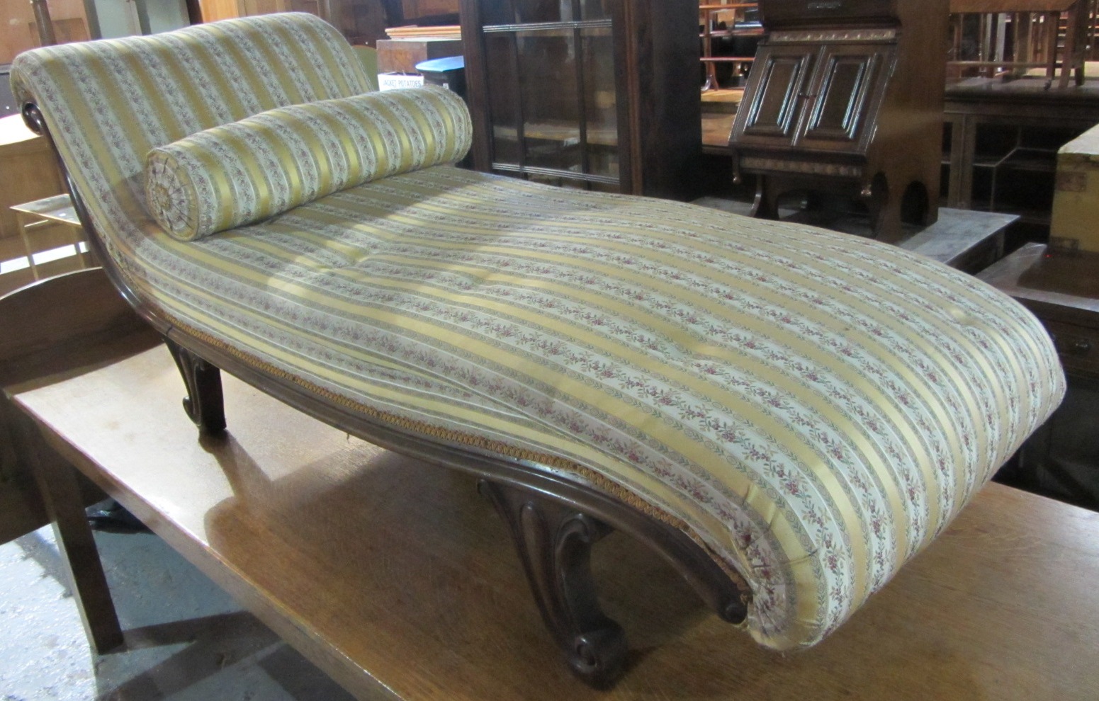 Appraisal: A th century mahogany framed chaise longue with yellow upholstery