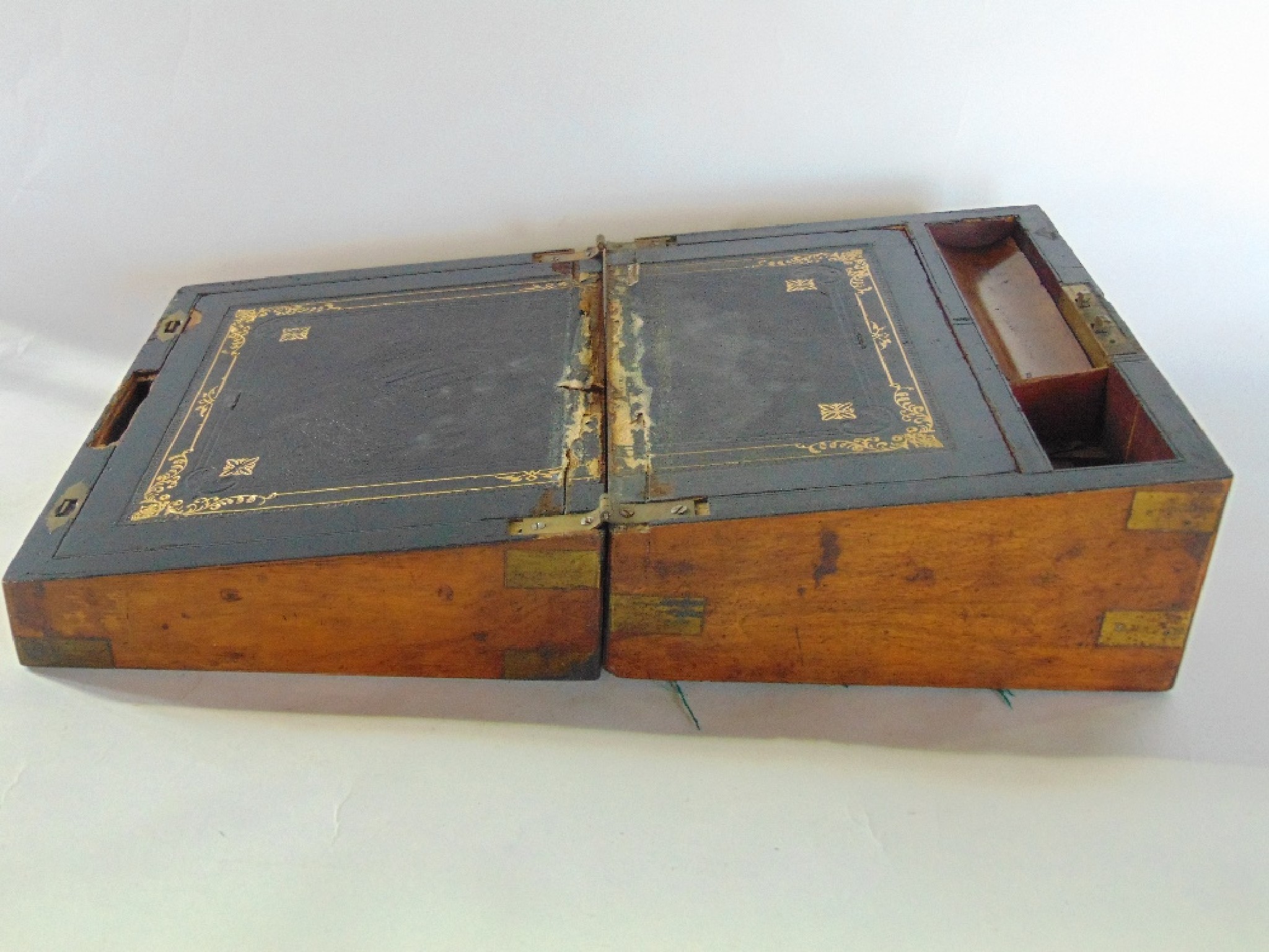 Appraisal: A Victorian walnut veneered writing box with further simulated grain