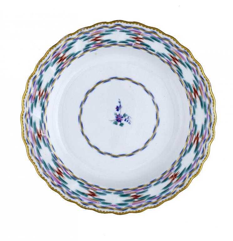 Appraisal: A DERBY PLATE enamelled with the Chintz pattern and a