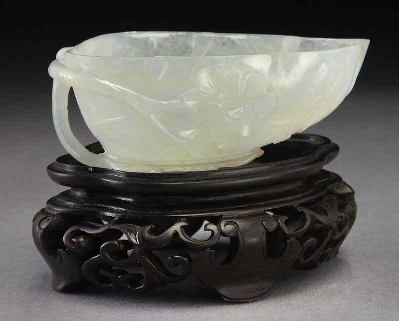 Appraisal: Chinese Qing carved Mughal style jade leaf shapedcup depicting plum