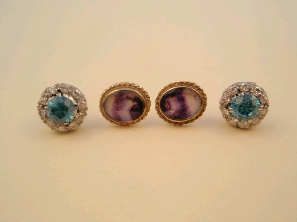 Appraisal: A pair of diamond and aqua stone set ear studs