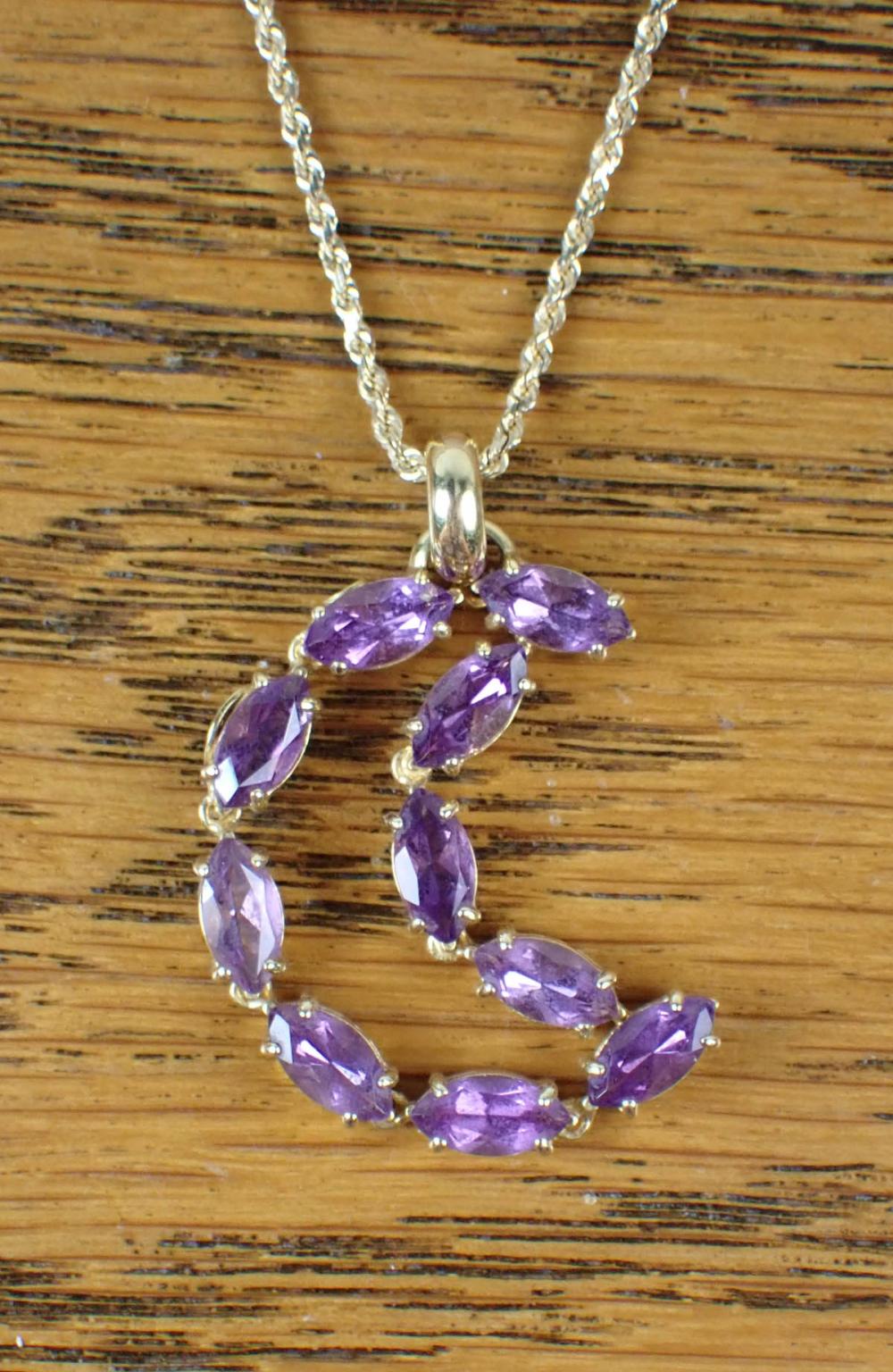 Appraisal: AMETHYST AND FOURTEEN KARAT GOLD PENDANT NECKLACE with an k