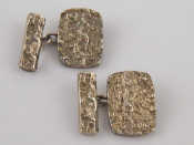 Appraisal: A pair of silver bark effect cufflinks maker SJR gms