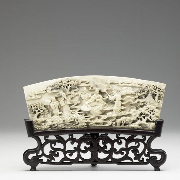 Appraisal: Carved ivory plaque depicts five characters serenading and fanning a