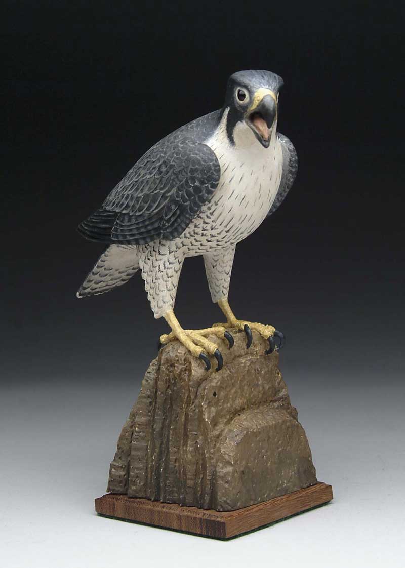 Appraisal: CARVED AND PAINTED PEREGRINE FALCON BY FRANK FINNEY Open beaked