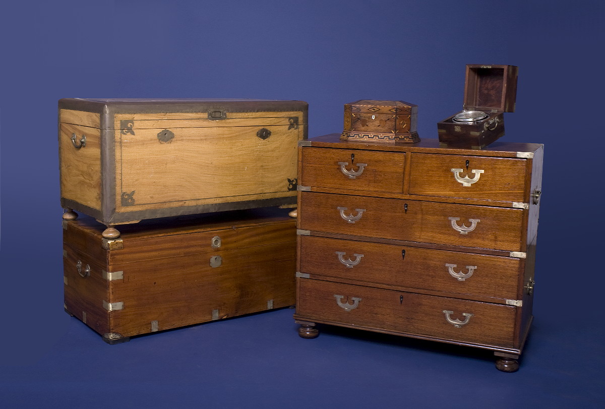 Appraisal: ANGLO-INDIAN CAMPHORWOOD BRASS-BOUND CHEST The hinged lid with inlaid brass