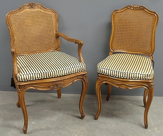 Appraisal: - Two similar French fruitwood armchair and side chair with