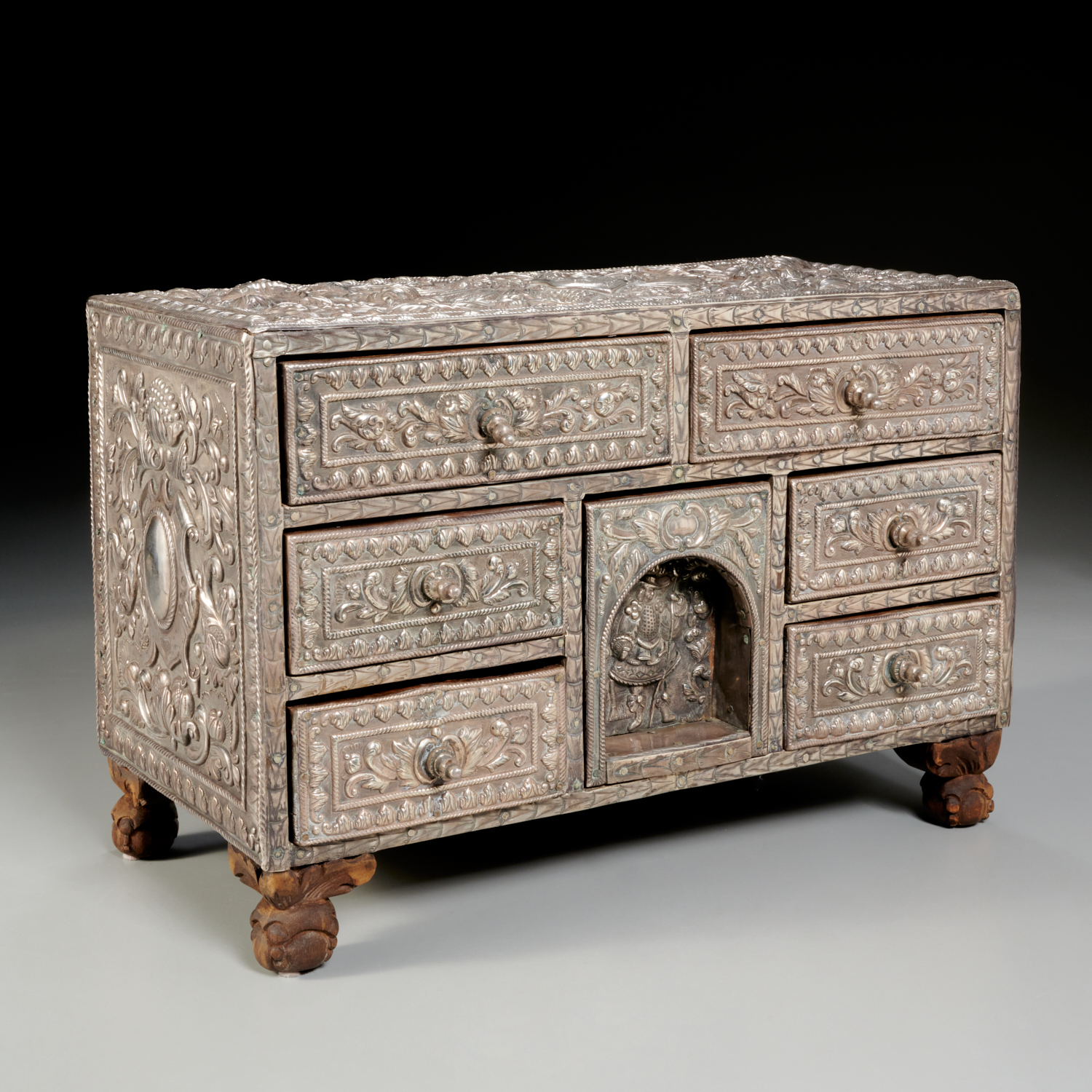 Appraisal: ANGLO-INDIAN SILVER-CLAD HARDWOOD CHEST th c seven-drawer hardwood tabletop chest