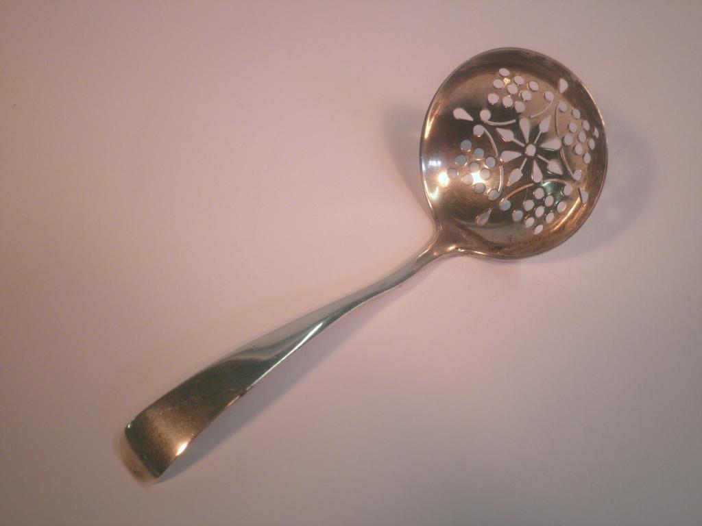 Appraisal: An Edward VII silver sifter spoon with a circular pierced