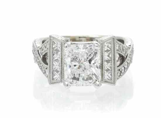 Appraisal: An Karat White Gold and Diamond Ring containing one radiant