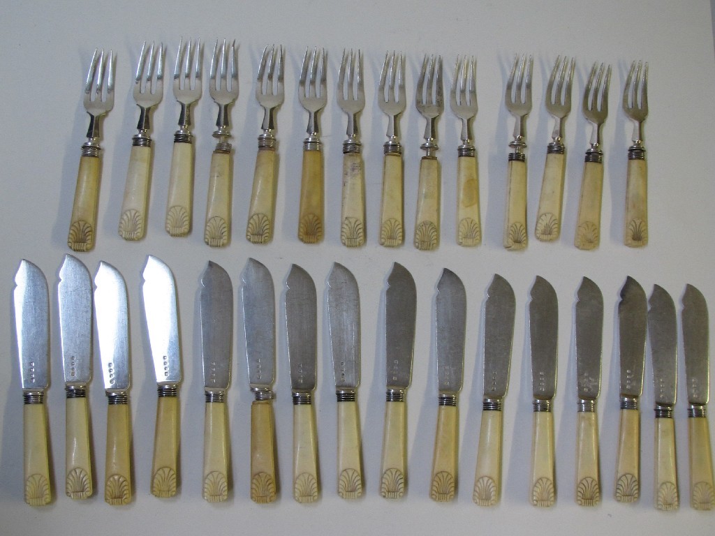 Appraisal: A suite of silver and ivory mounted cutlery the handles