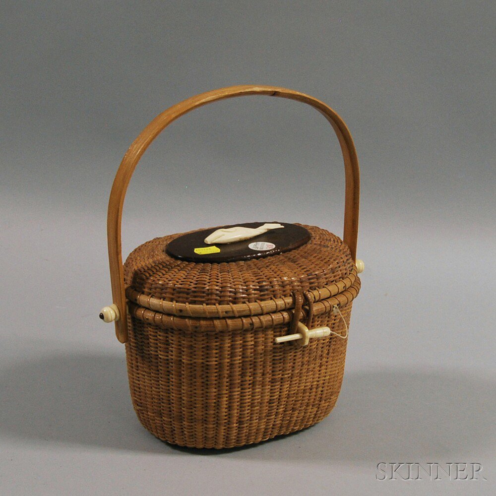 Appraisal: Oval Nantucket Basket Purse late th century with swing handle