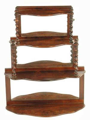 Appraisal: A set of Victorian rosewood graduated hanging wall shelves with