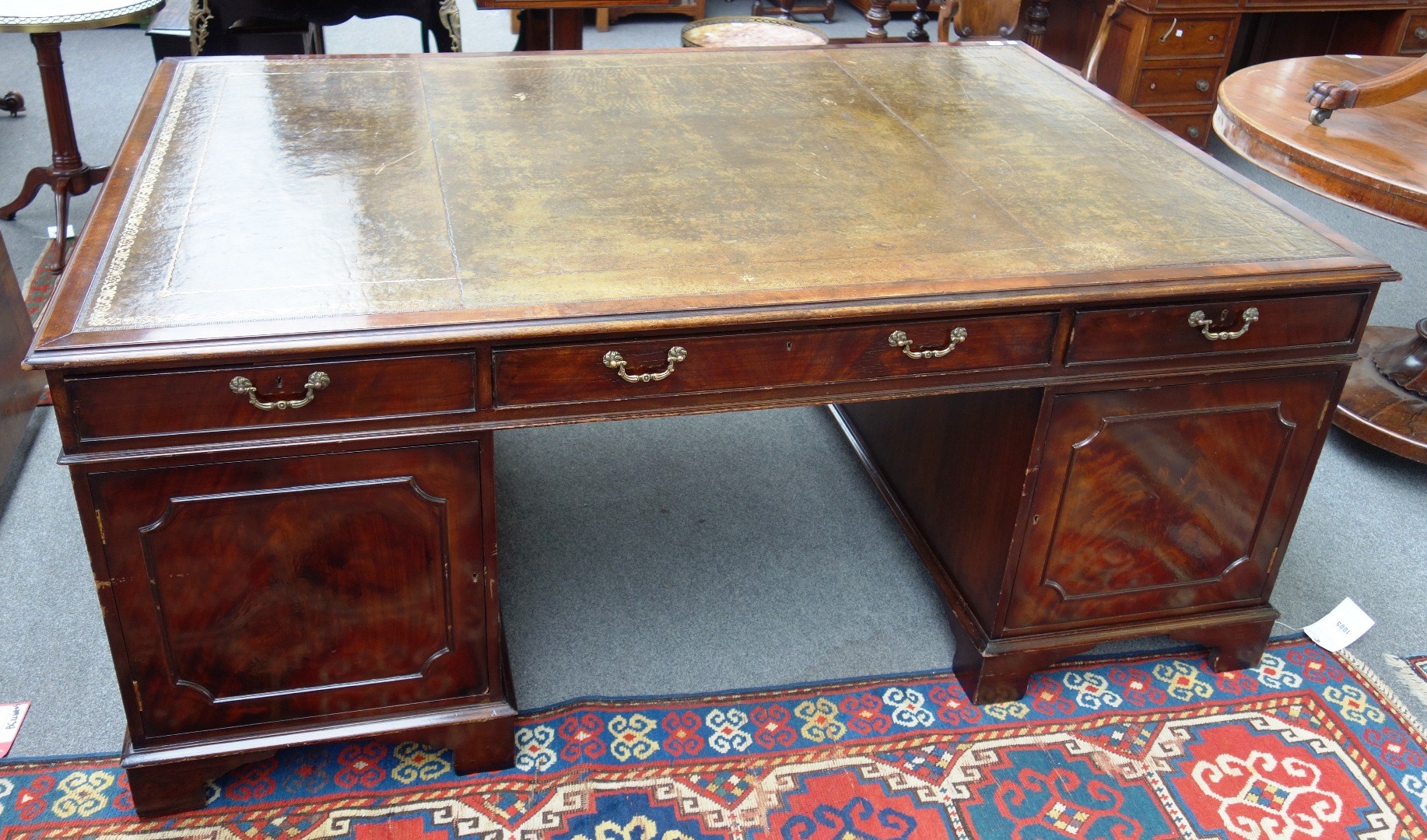 Appraisal: An th century style mahogany partners pedestal desk with nine