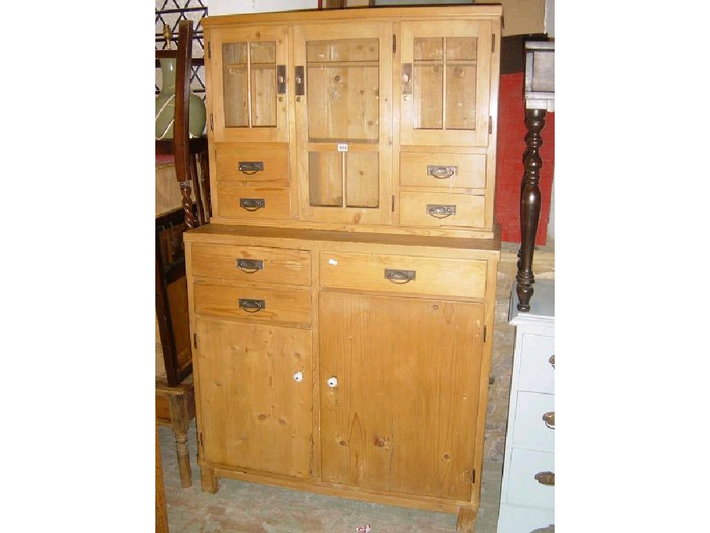 Appraisal: A pine two tier dresser the upper section fitted with