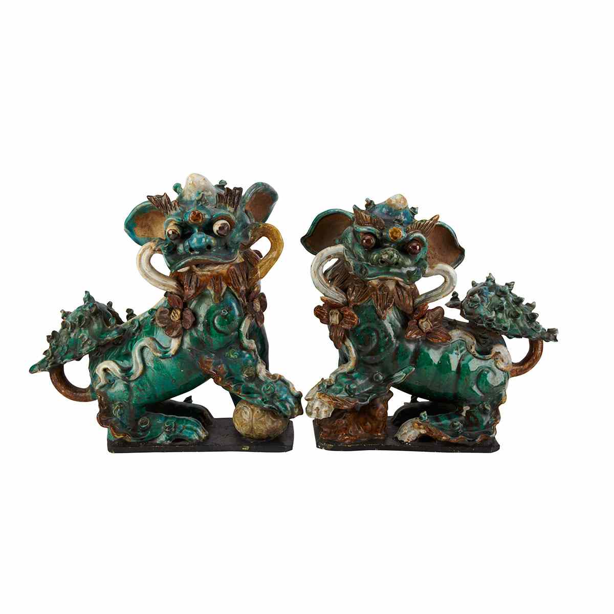 Appraisal: Pair of Green Glazed Fu-Lions th Century Playfully rendered with