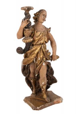 Appraisal: A Spanish carved figural candle stand modelled as a figure