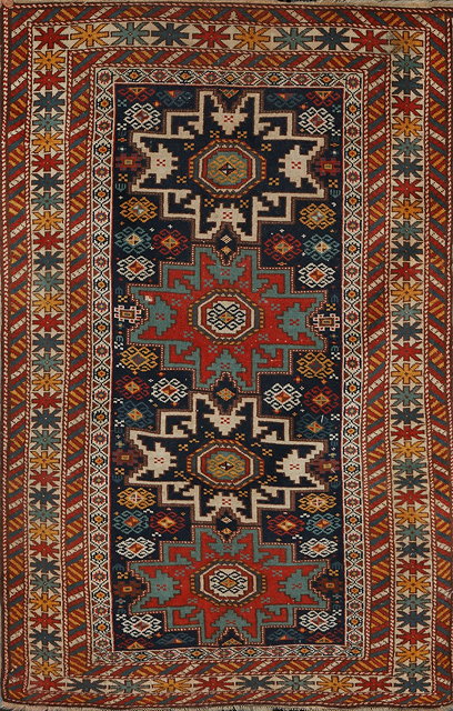 Appraisal: A SHIRVAN RUG the interlocking central medallions on a dark