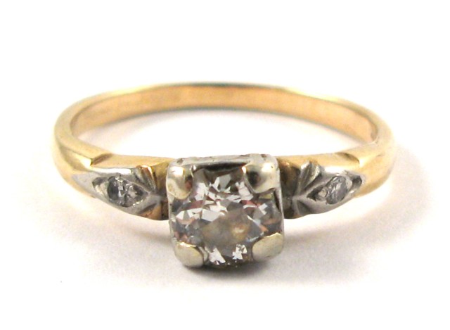 Appraisal: DIAMOND AND FOURTEEN KARAT GOLD RING centering a round-cut diamond