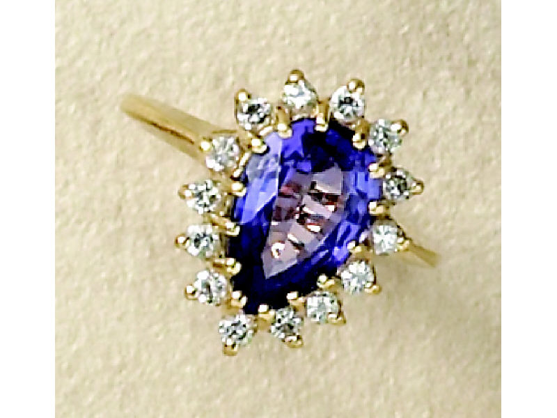 Appraisal: TANZANITE AND DIAMOND RING k yellow gold ring set with