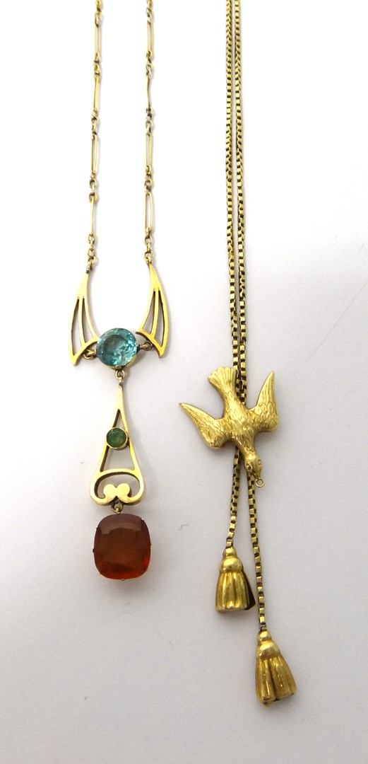 Appraisal: A gold blue zircon and gem set pendant necklace on