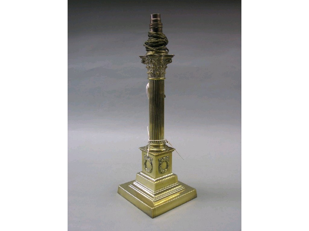 Appraisal: A brass table lamp reeded stem with Corinthian capital on