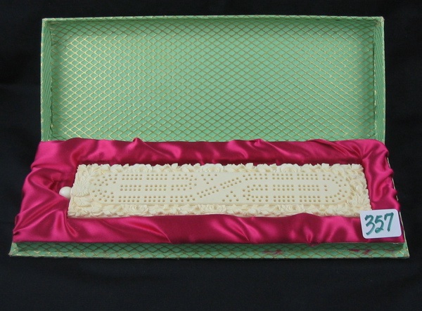 Appraisal: A CHINESE CARVED IVORY CRIBBAGE BOARD with flowers and foliage