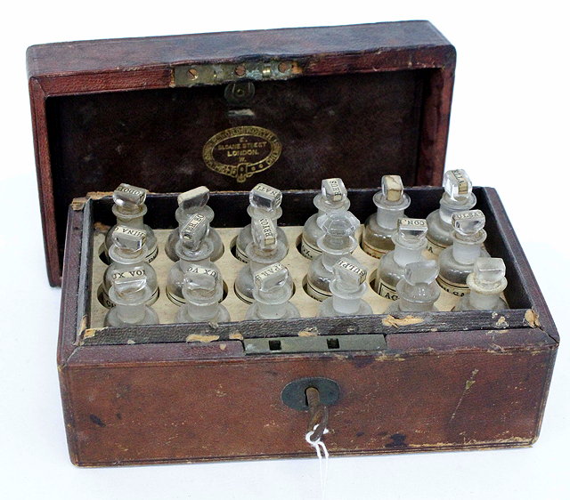 Appraisal: AN EARLY VICTORIAN MOROCCAN LEATHER CASED SET OF APOTHECARY BOTTLES