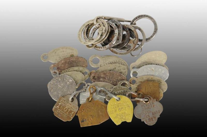 Appraisal: Lot of Dog License Tags Advertising Key Rings Description Antique