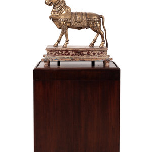 Appraisal: An Indian Brass Model of a Bull in a Walnut