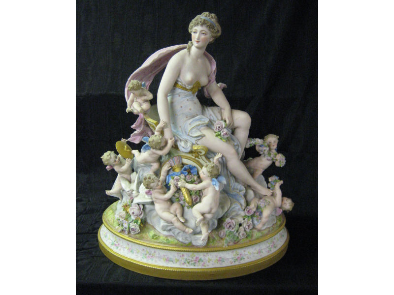 Appraisal: FRENCH BISQUE ALLEGORICAL FIGURE GROUP A woman seated in a