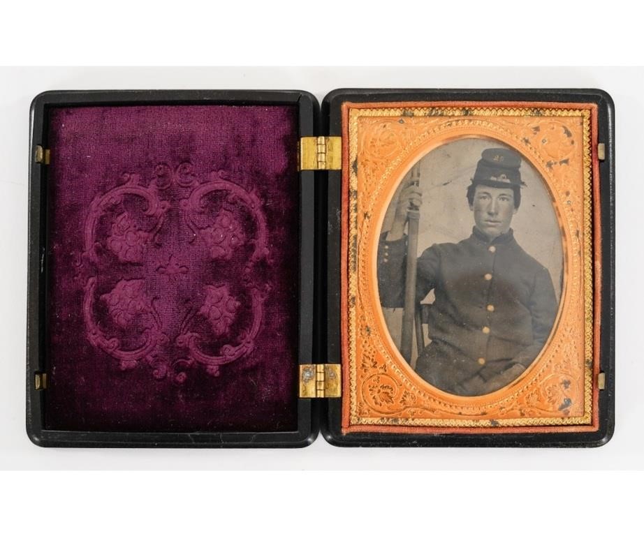 Appraisal: Tintype of a Civil War Union soldier holding a musket