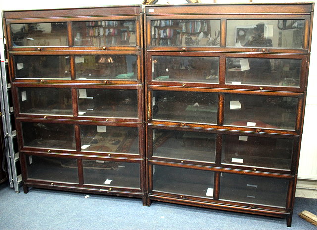 Appraisal: A PAIR OF GLOBE WERNICKE STYLE OAK SECTIONAL BOOKCASES each