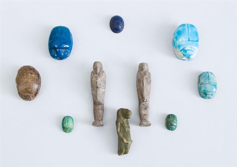 Appraisal: GROUP OF THREE EGYPTIAN FAIENCE USHBATIU AND SEVEN GLAZED FAIENCE