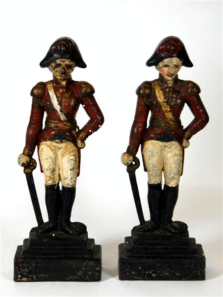 Appraisal: Two painted cast iron door stops of th century army