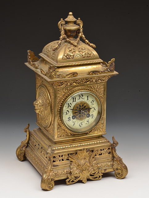 Appraisal: A GILT BRASS CASED MANTEL CLOCK with French movement the