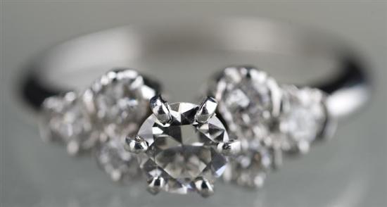 Appraisal: Platinum and diamond ring The ring has three small diamonds