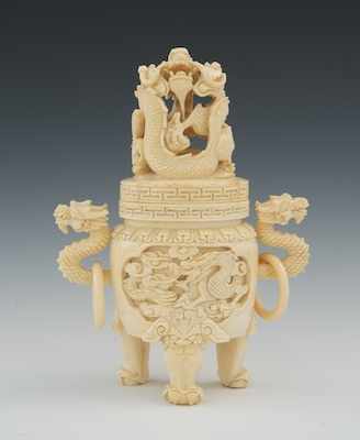 Appraisal: A Carved Ivory Koro Standing on three dragon claw legs