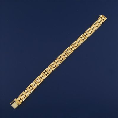 Appraisal: An ct gold strap bracelet of polished torpedo and foliate