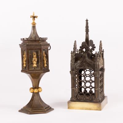 Appraisal: A Gothic Revival candle holder modelled as a tabernacle with