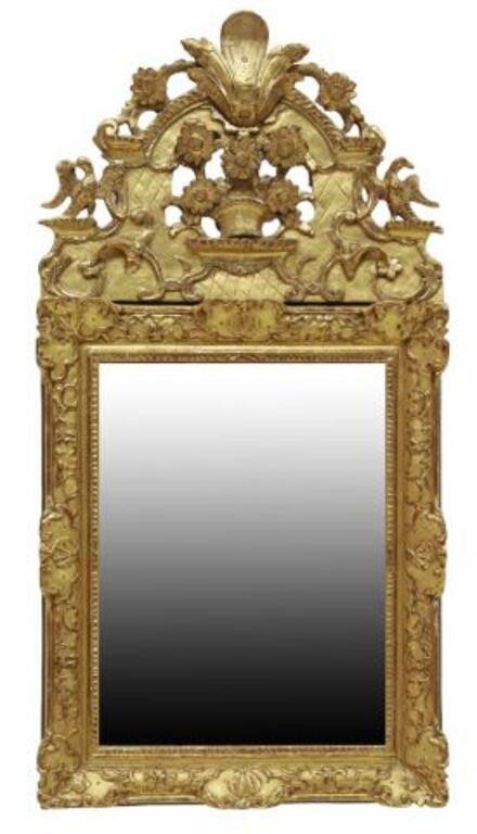 Appraisal: French Regence style giltwood and composite mirror having shaped crest