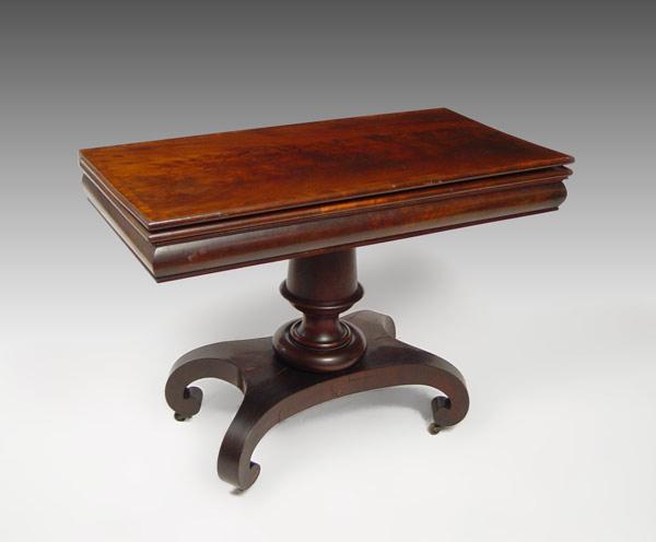 Appraisal: EMPIRE FLAME MAHOGANY CARD TABLE Turned pedestal base with rolled