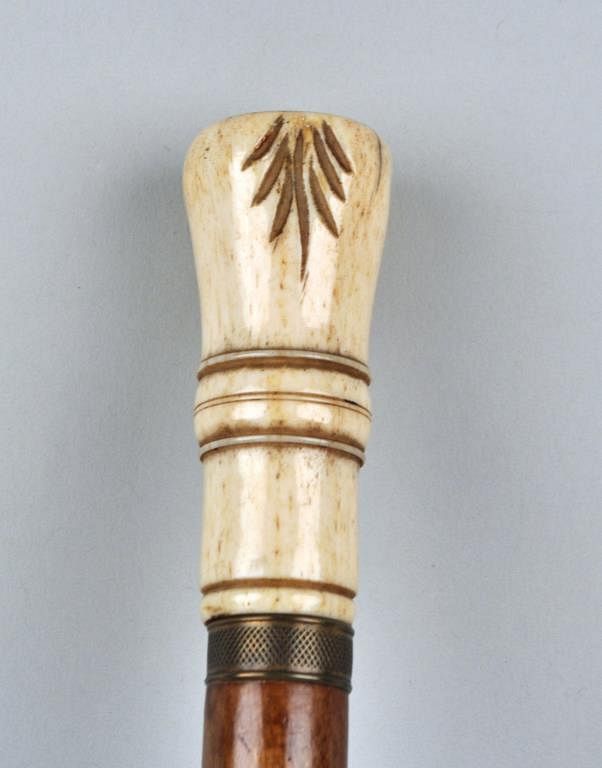 Appraisal: Carved Whalebone Cane with brass collar and wood shaft th